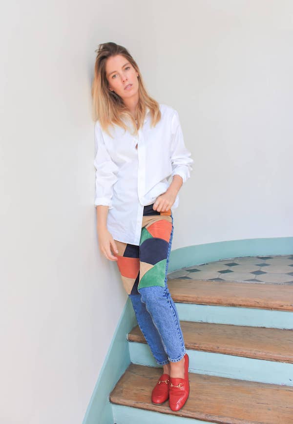Upcycled jeans using a patchwork of multicoloured leathers