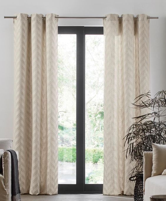 Long white curtains with eyelets