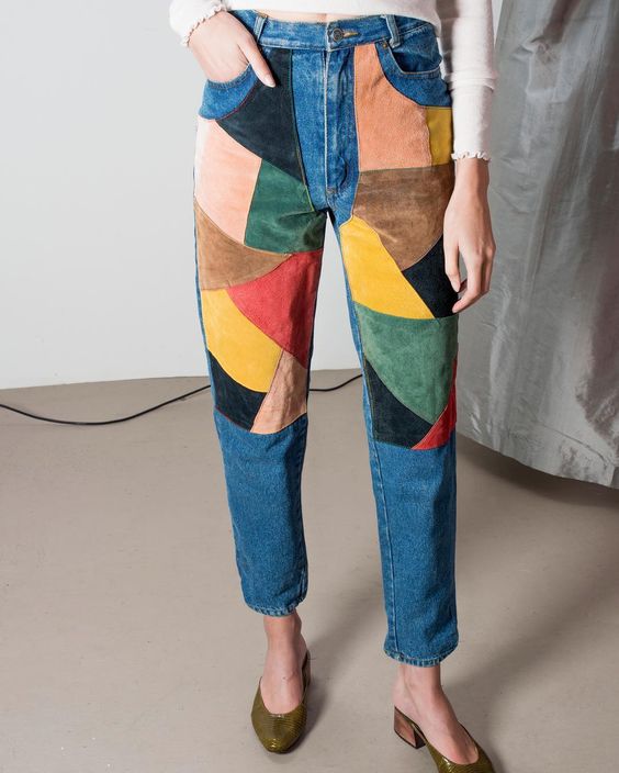 Jeans with patchwork of coloured leather patches