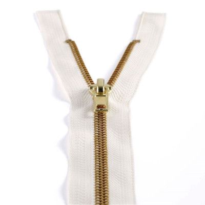 Half-open zip on white fabric