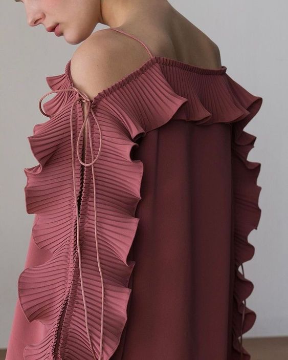 Pink open-shoulder dress with ruffled sleeves